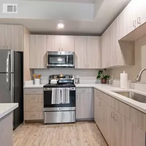 The kitchen at The Sanctuary at 331 Apartments blends modern style with functionality.