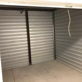 Inside view of a clean, spacious drive-up storage unit at River Crossing Storage & RV in Goodyear, AZ, ideal for easy loading and convenient access.