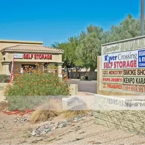 Entrance signage and street view of River Crossing Storage & RV in Goodyear, AZ, conveniently located on West Van Buren Street with easy access from Interstate 10.