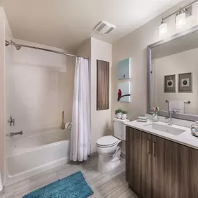 a bathroom with a toilet sink and bathtub
