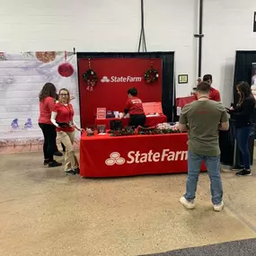 We brought the red, the smiles, and the good neighbor energy! Come visit our booth today and say hey!