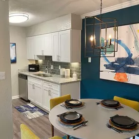 A modern kitchen with a dining table