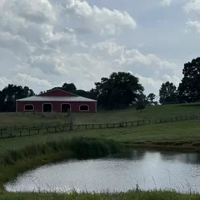 Rafter X Ranch indoor arena and pond