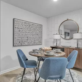 a dining room with a table and chairs