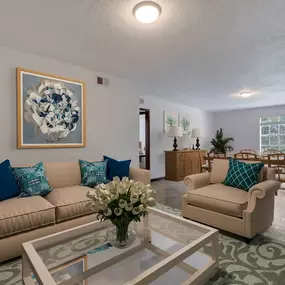 A living room and dining room with couches and a table