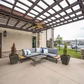 A patio with tables and chairs