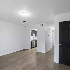 An empty room with wooden floor