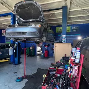 I & F Transmission Specialist - car on lift for repairs