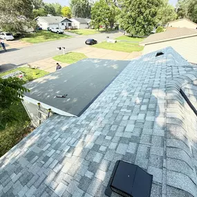 This photo shows the completed roof replacement by Gehlen Construction in Shakopee, Minnesota. The home now features a fully upgraded roofing system, including both the pitched and flat roof areas, providing improved protection, drainage, and curb appeal.