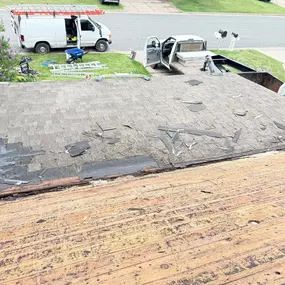 This photo shows a home in Shakopee, Minnesota before Gehlen Construction began a full roof replacement. The existing roof features both a traditional pitched section and a flat roof area, both in need of updated materials and improved protection.