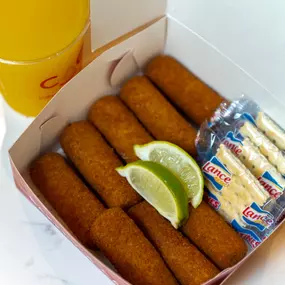 Several ham croquettes in a box.