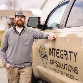 Lucas beside his Integrity Air Solutions Service Truck