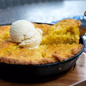 Redstone Cornbread | skillet baked & served with house maple butter | available as wedge