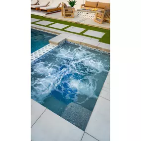 Built-in spa for a custom swimming pool turned on to demonstrate its use.