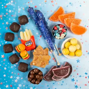 Fun assortment of novelty and kids’ candies, including gummy fries, candy burgers, rock candy, chocolates, and jelly beans, ideal for retail and wholesale candy distribution.