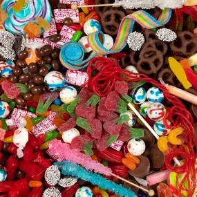 Bulk candy selection with chocolate-covered treats, sour belts, licorice, and retro favorites available for wholesale.