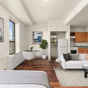 A modern living room with a grey sofa and a coffee table
