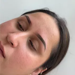 An image of freshly done ombré brows in Riverton, Utah, with a soft gradient from light at the front to darker at the tail.