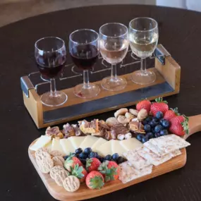 A detailed shot of Tranquillity Vineyard’s signature wine tasting tray and cheese board—local ingredients, expertly paired.