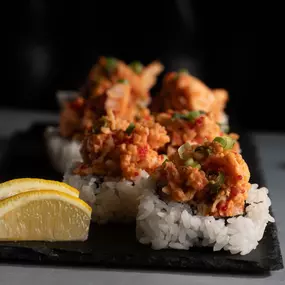 Tempura fried kanikama stick and shredded krab inside, topped with spicy lobster claw salad. Served with a lemon wedge for an added bite!