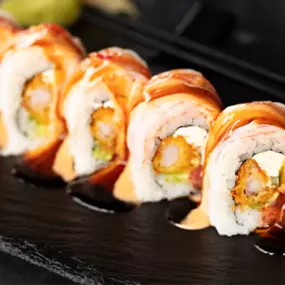 Spicy tuna, imported shrimp tempura, cream cheese, avocado and cucumber topped with krab stick, spicy mayo, sweet chili and eel sauce.