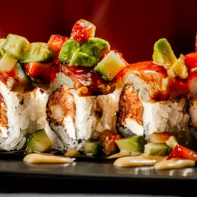 Shrimp tempura, spicy tuna, cream cheese inside, seared tuna outside, topped with strawberry-avocado-jalapeno-cucumber salad, sweet-chili-ponzu dressing, spicy mayo, and eel sauce.