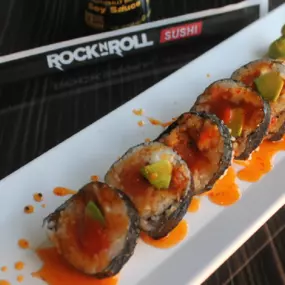 Let freedom ring with: Spicy tuna, smoked salmon, cream cheese, avocado with sweet chili and sriracha in every bite!!