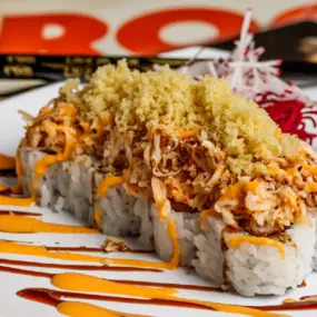 Shrimp tempura inside, topped with baked krabmeat, spicy mayo, eel sauce, and crunchy flakes.