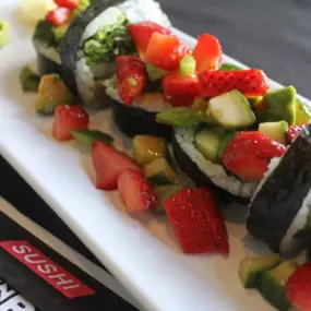 Your new favorite summer crush. 6 piece veggie roll topped with our signature punk rock topping.  Fresh, sweet and spicy. This item is vegan and vegetarian.  Roll contains avocado, spring mix, cucumber, strawberry, jalapeno, ponzu and sweet chili sauce.