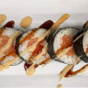 (ORIGINAL OR FRIED) Fresh Salmon inside, topped with spicy mayo and eel sauce.
