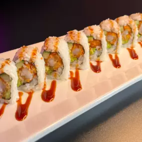 Sprimp Tempura, cucumber, avocado inside, topped with eel sauce.