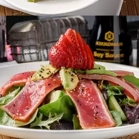 Seared tuna slices, cucumber, avocado and straberries piled on spring greens. Topped with sweet chili or ginger dressing, ponzu and sesame seeds.