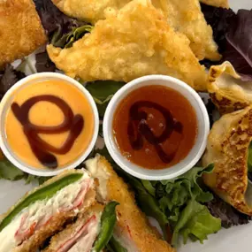 Crispy wontons, jalapeno poppers, eggroll and potstickes served with headbanger and sweet chili dip, both swirled with eel sauce.