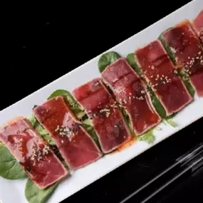 Red tuna lightly seared, sliced, drizzled with sweet chili, ponzu and eel sauces and finished with a sprinkle of sesame seeds. A rare treat.