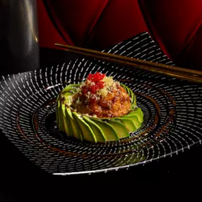 Our spin on tuna tartare. Chopped, spicy red tuna and coolly twisted avocado topped with tobiko, sweet chili, eel sauce and crunchy flakes. Served with wonton chips