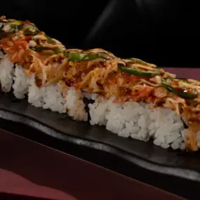 Cajun seasoned crawfish, cream cheese, krab stick inside, baked krabmeat and jalapenos outside, topped with spicy mayo, sweet chili and eel sauce.