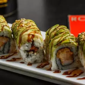 Shrimp tempura, krab stick and spicy mayo inside, avocado outside, topped with sweet chili, eel sauce and sesame seeds.