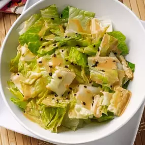 Chopped romaine with a sweet, refreshing ginger-sesame dressing.