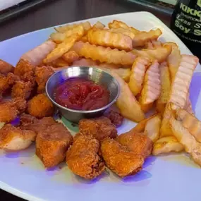 Hand breaded chicken nuggets and fries. Served with ketchup.