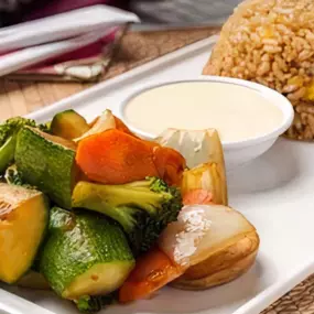 Fried Rice with Grilled Hibachi vegetables. Served with Yum Yum Sauce.