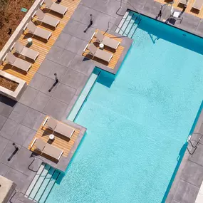 Large swimming pool with sun loungers
