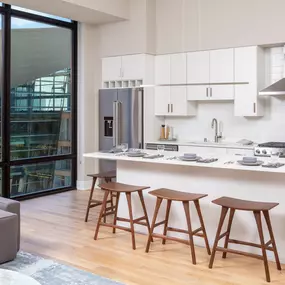 A kitchen with white cabinets