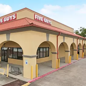 Exterior photograph of the Five Guys restaurant at 5300 Tchoupitoulas Street in New Orleans, Louisiana.