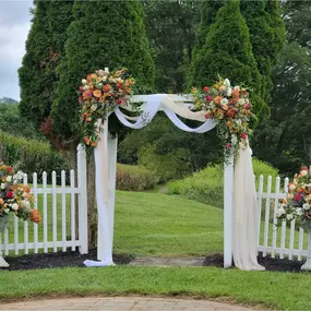 Double fall floral arch pieces with side urn pieces for a wedding near Hagerstown Maryland 21740 designed by Christina Price of Homestead Floral Wedding & Events.