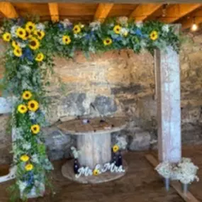 Sunflower archway design for a wedding near Hagerstown, MD 21742 designed by Christina Price of Homestead Floral Wedding & Events.