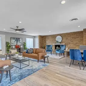 An office with blue chairs and a wooden desk