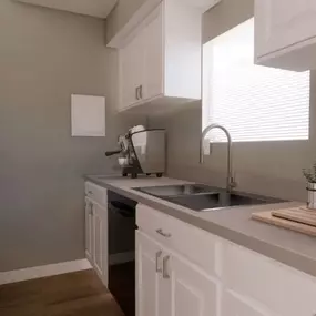 A kitchen with a gray sink