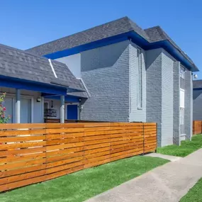 A wooden fence in front of a building