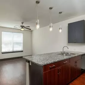 A kitchen with a granite countertop