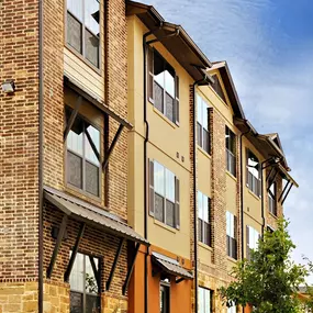 A large building with a brown and tan exterior